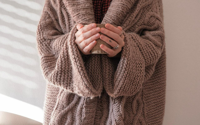 Instead of overheating your home, program your thermostat correctly and wear a sweater if you're cold. 