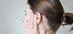 clogged ears remedy woman pain