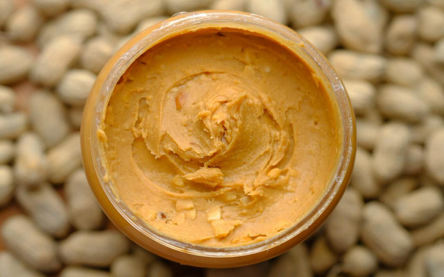 You should put peanut butter in clean containers before freezing to avoid cross contamination. 