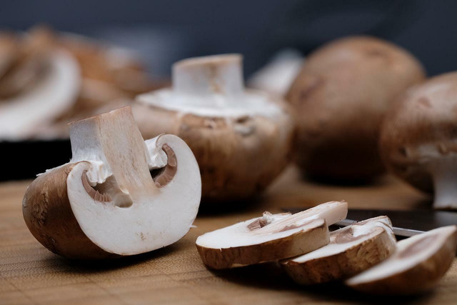Chop and cook mushrooms before freezing them.