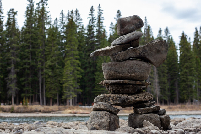 Make a sculpture using rocks.
