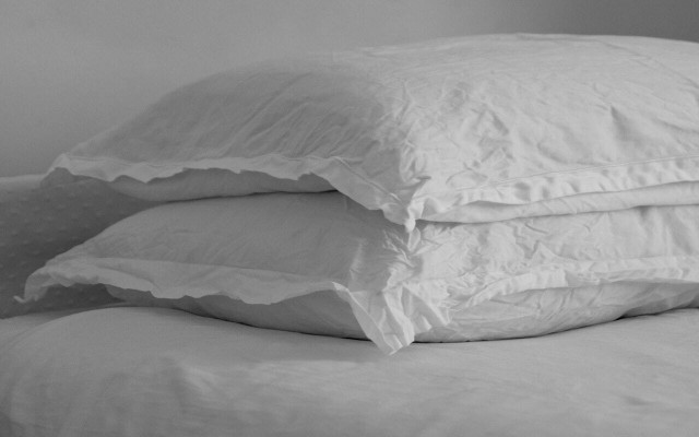 Propping your head up with an additional pillow can help alleviate some of the pressure in your head. 