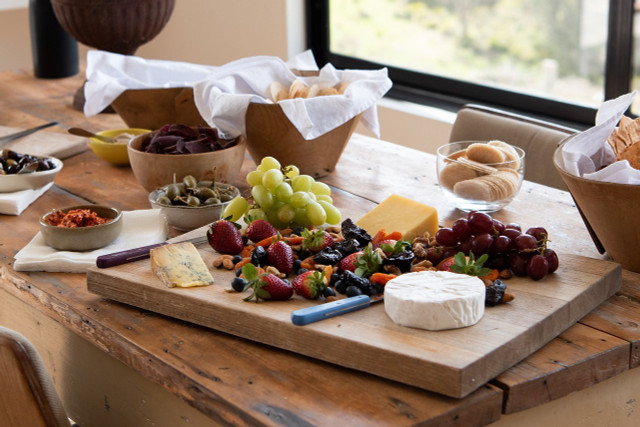 Spice up your  vegan cheese board by adding some crackers, spreads, olives or berries. 