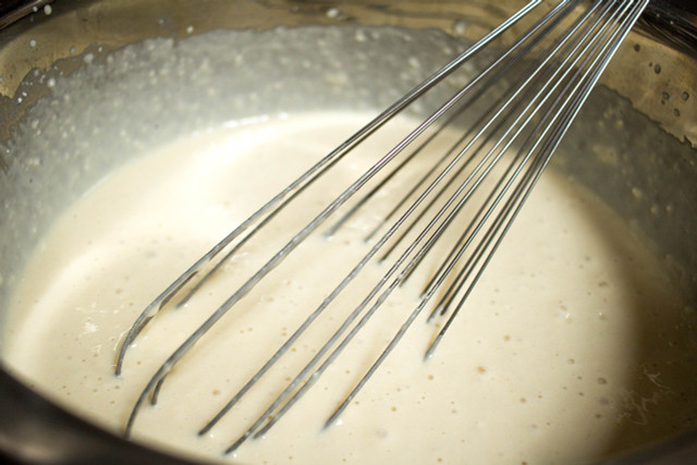 Whisk the mixture until it thickens.
