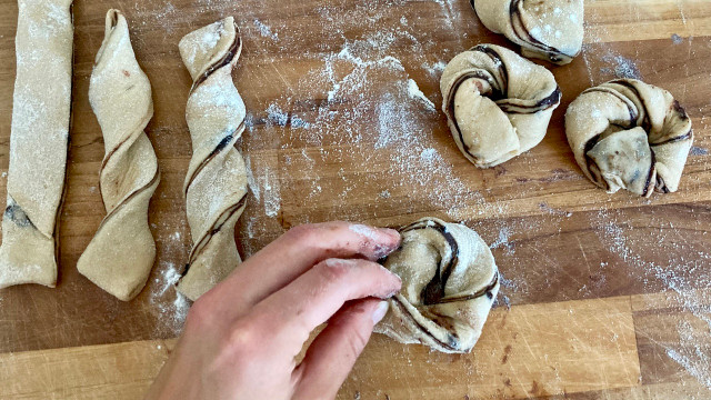 Twist the strips of dough into rough knots. 