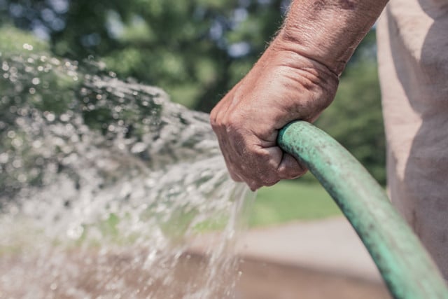 Use your garden hose to help clean brick outdoors. 