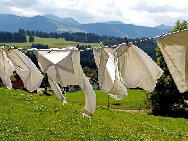 Hanging curtains on the line is the best way to dry them.