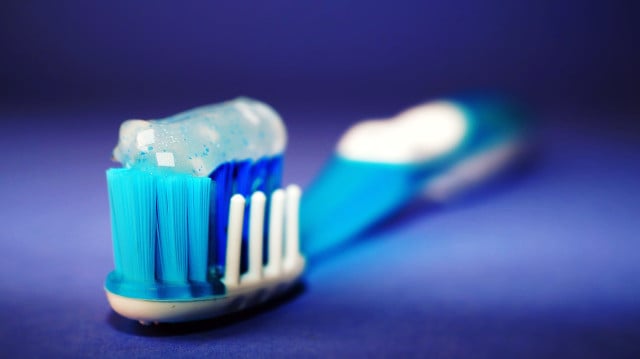 Bacteria left on your toothbrush can multiply, which is why it's important to disinfect it regularly.