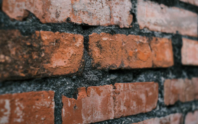 Cleaning brick can require a bit of elbow grease if there are stubborn stains. 