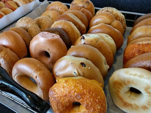 Use parchment paper or paper bags in order to freeze your bagels without plastic.