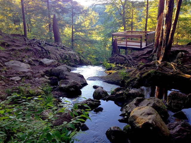 Visit Buttermilk Falls for serene hikes along the water.