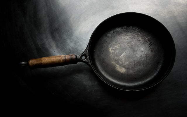 A properly seasoned cast iron skillet should have a shiny black patina.