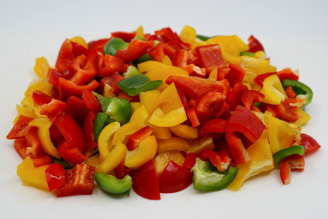 Once you've chopped up your peppers, spread them out on a baking tray for freezing. 