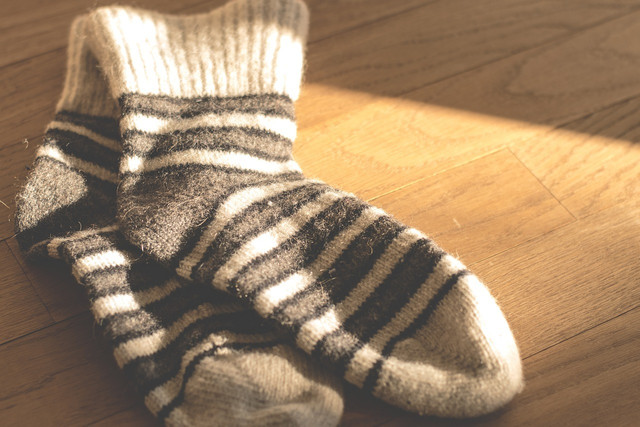 Learn how to help homeless people through donations of socks and other clothing items. 