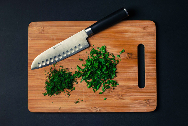 Prepare parsley for freezing by chopping it first. 