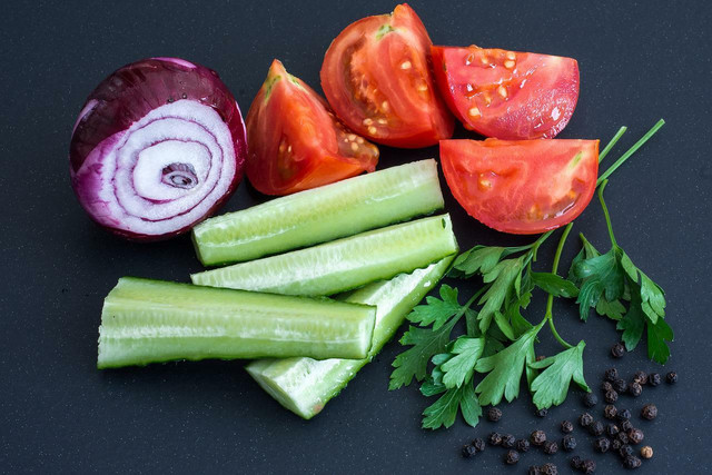 The base of this mediterranean cucumber salad simply includes cucumbers, tomatoes, and herbs, but you can add more ingredients for a fancier dish. 