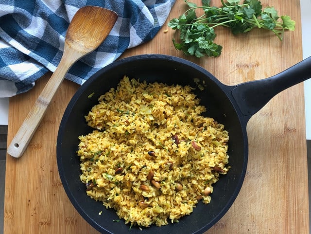 Garnish your poha with cilantro and grated coconut before you serve it!