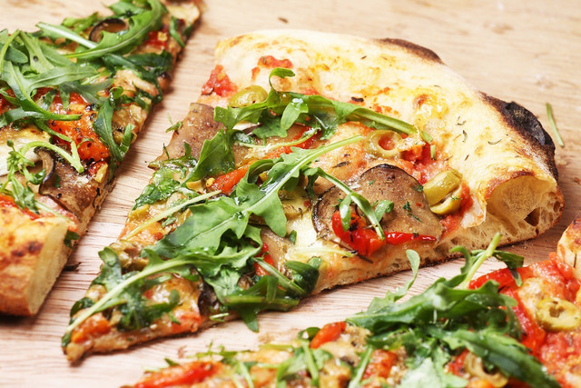 Add a fresh note by scattering arugula across your pizza after baking.