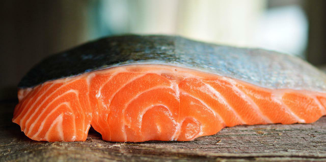 Farmed salmon is an artificially colored food.