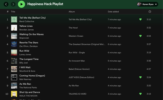 Creating a playlist that makes you happy is key to this hack.