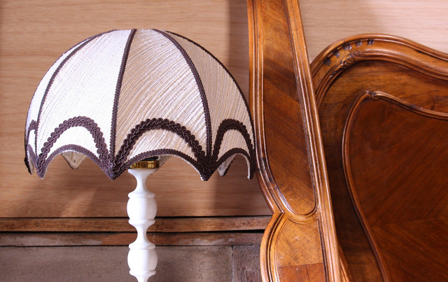 You can clean fabric lampshades using the dusting brush on your vacuum cleaner.