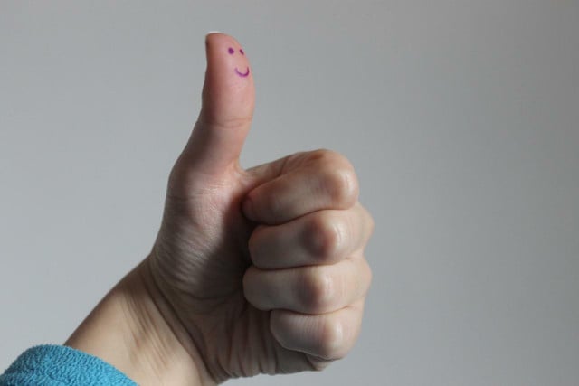Suppressing your emotions and giving a big thumbs up is a definite sign of toxic positivity.