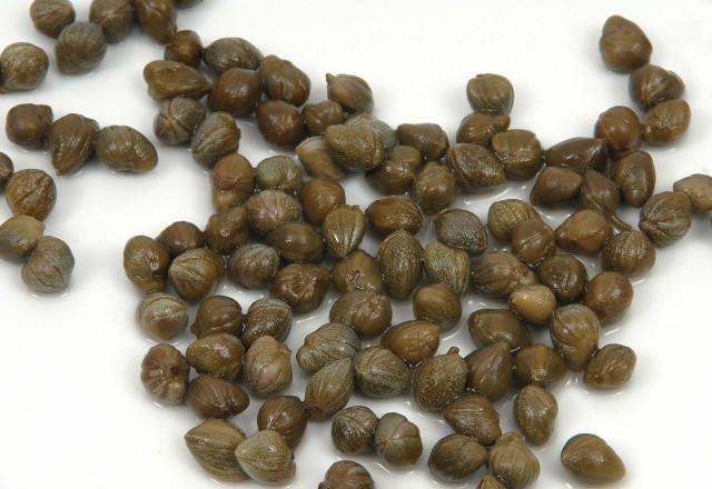 Capers are often found in anchovy tins.