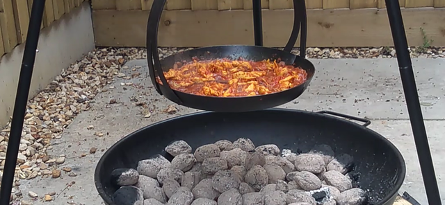 This curry can be cooked on a tripod skillet.