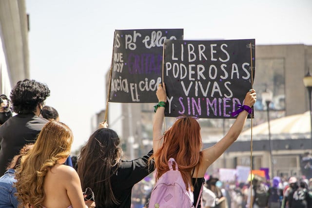 The sign on the right reads "free, powerful, alive and without fear."