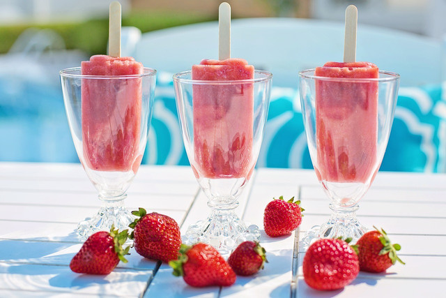 Strawberry margarita popsicles add a fruity twist to the sour and salty tequila based classic cocktail. 