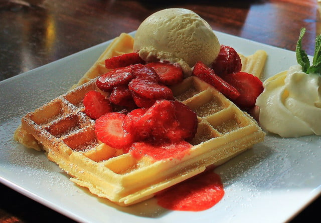 Try fresh fruit, nice cream or vegan clotted cream on your waffles.