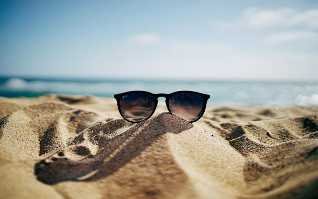 Add sunglasses to your packing list for your beach vacation so you don't need to purchase cheap plastic ones at the beach. 