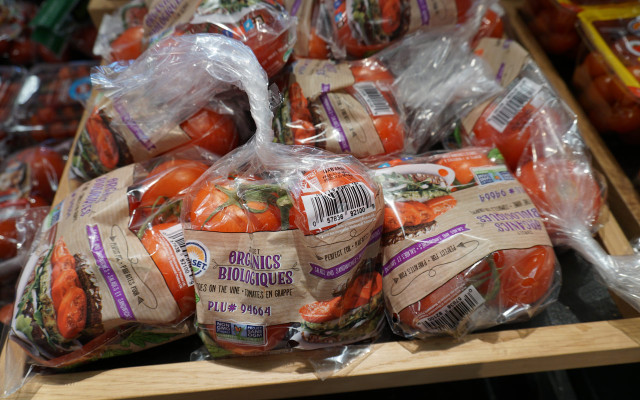 Tomatoes in plastic wrap packaging waste