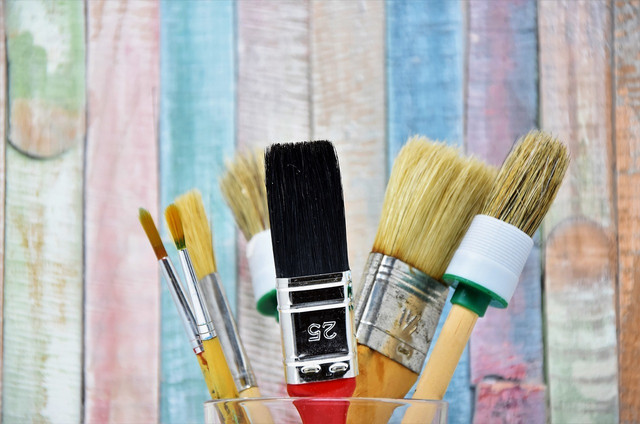 Use differently shaped paint brushes.