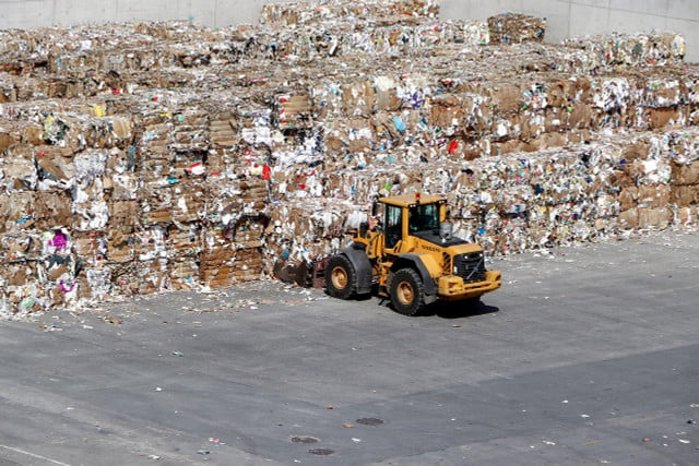 Paper is recycled at recycling centers where contaminants are removed first.