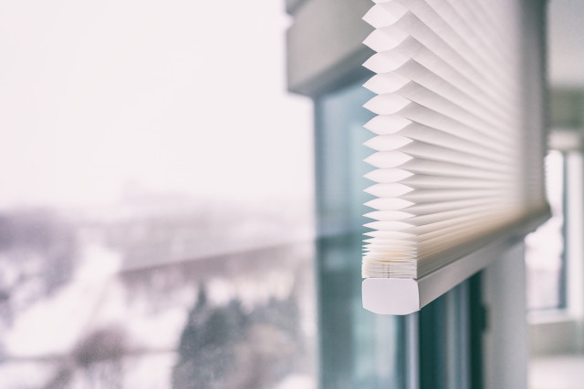 Honeycomb blinds are easy to use and effective against the heat.