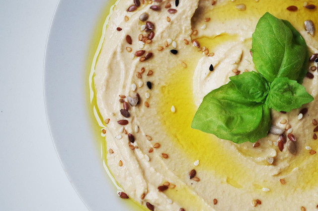 Hummus is one of the most versatile vegan picnic ideas — top it with fried mushrooms, crispy chickpeas, or a spoonful of sriracaha. 