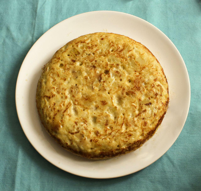 Use the whole vegan omelette batter to make one thick Spanish style tortilla. 