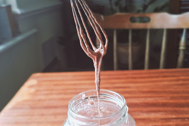 Check the consistency of your homemade toothpaste as you add the water.