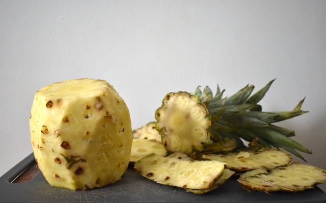After removing the skin, don't let it go to waste. Use the skin and core to make pineapple infused water. 