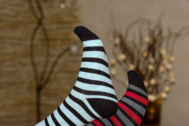 A nice pair of cotton socks will help your feet breathe while keeping your home remedies on.