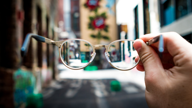 clean glasses held up to see a street
