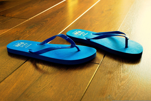A pair of shower shoes or slides is an essential dorm room item to have.