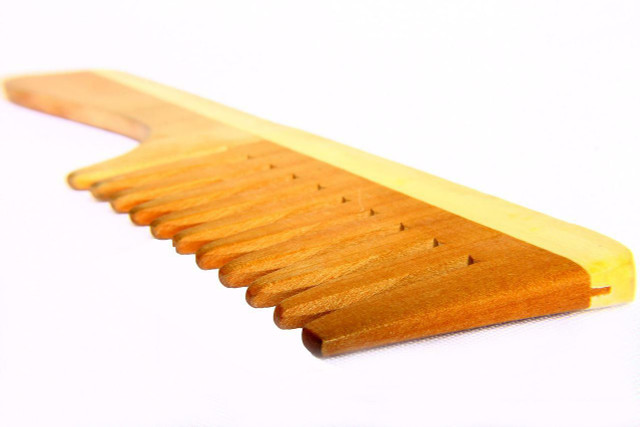 Using a wide-toothed wooden comb can reduce static hair.