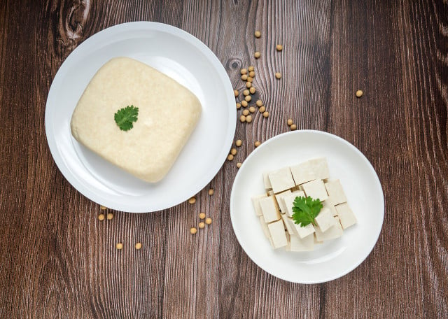 Cut the tofu into equal-sized cubes before frying.