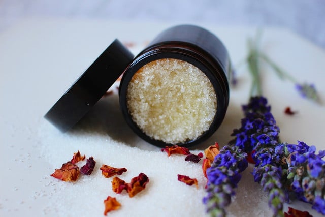 Body scrubs remove dead skin cells and promote circulation, all of which help smooth the skin on your legs.